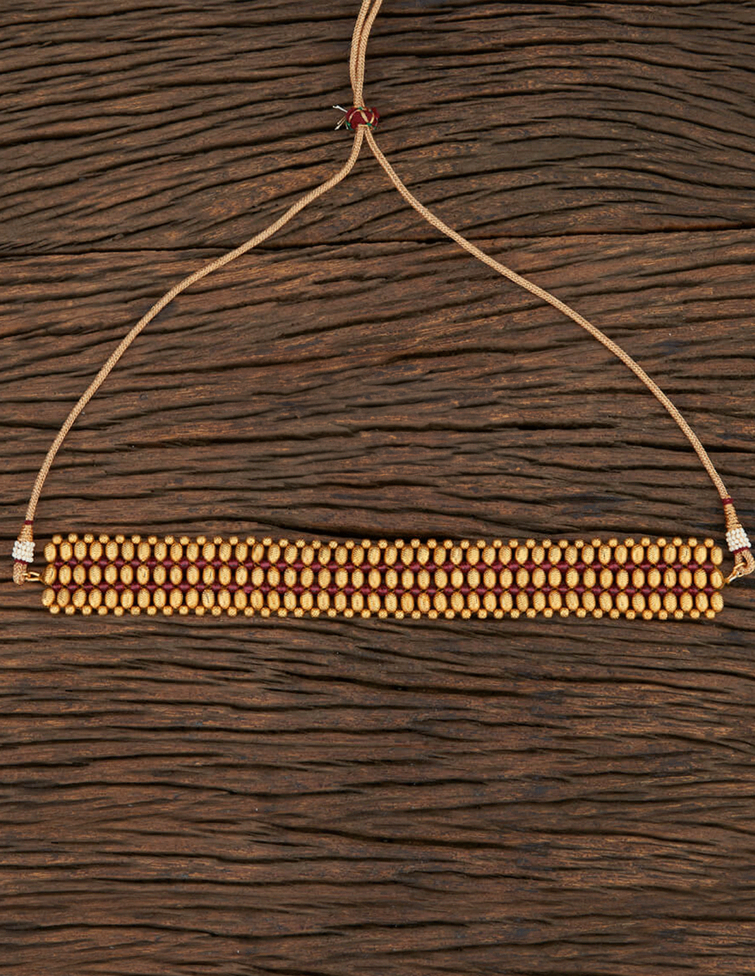 Choker dorado con pedrería granate